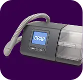 CPAP machine with digital display and hose on purple background